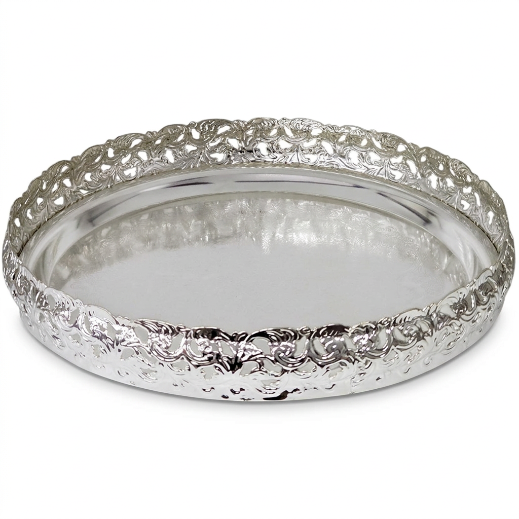 A round silver tray with a highly detailed, textured floral pattern around its raised rim and a smooth, polished interior, shown on a plain white background.