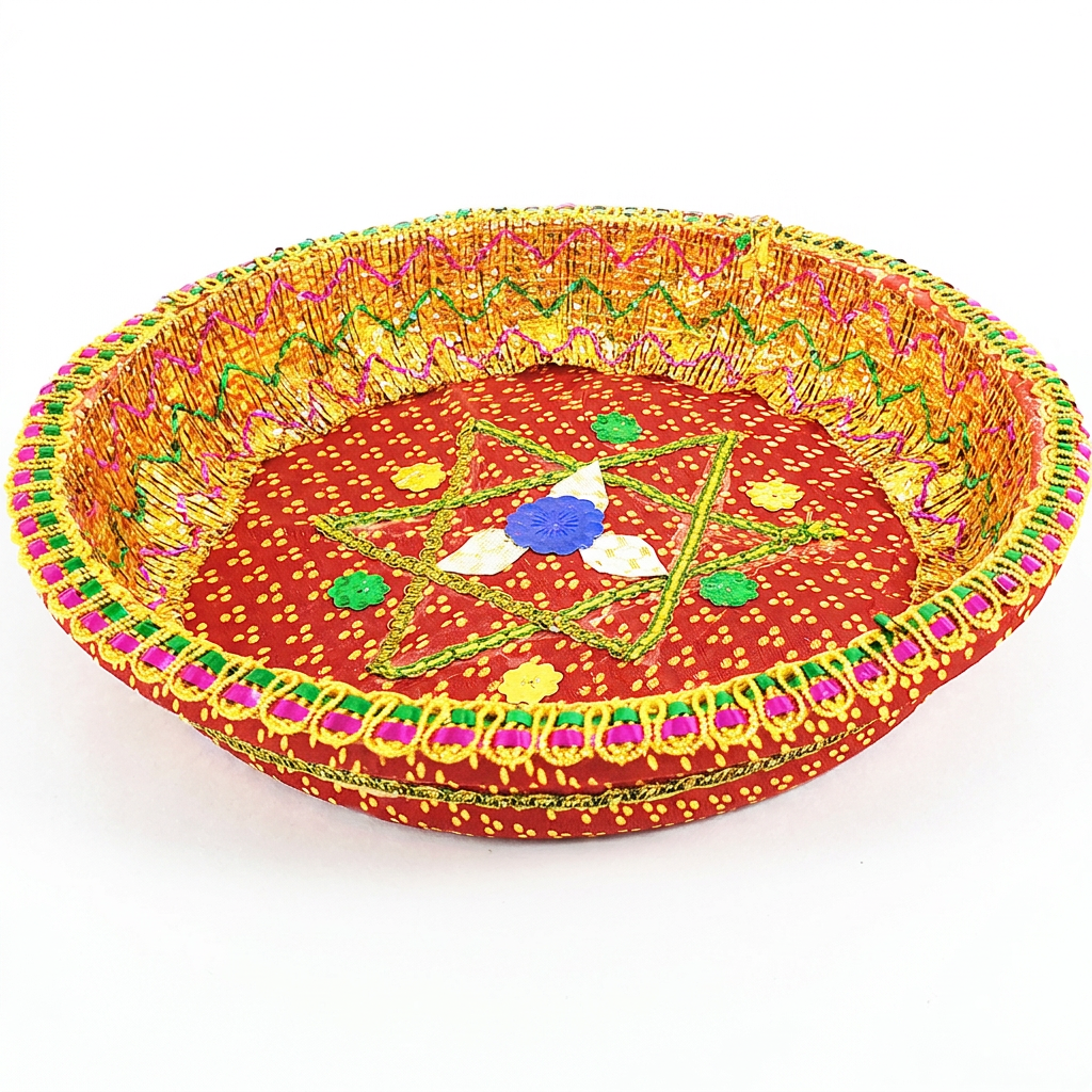 A round, hand-woven decorative tray or basket with a red fabric base, featuring a central embroidered star design in green, yellow, blue, and white, surrounded by a colorful braided border.